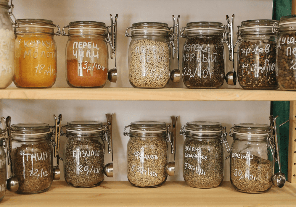 Pantry closet organized with glass jars.