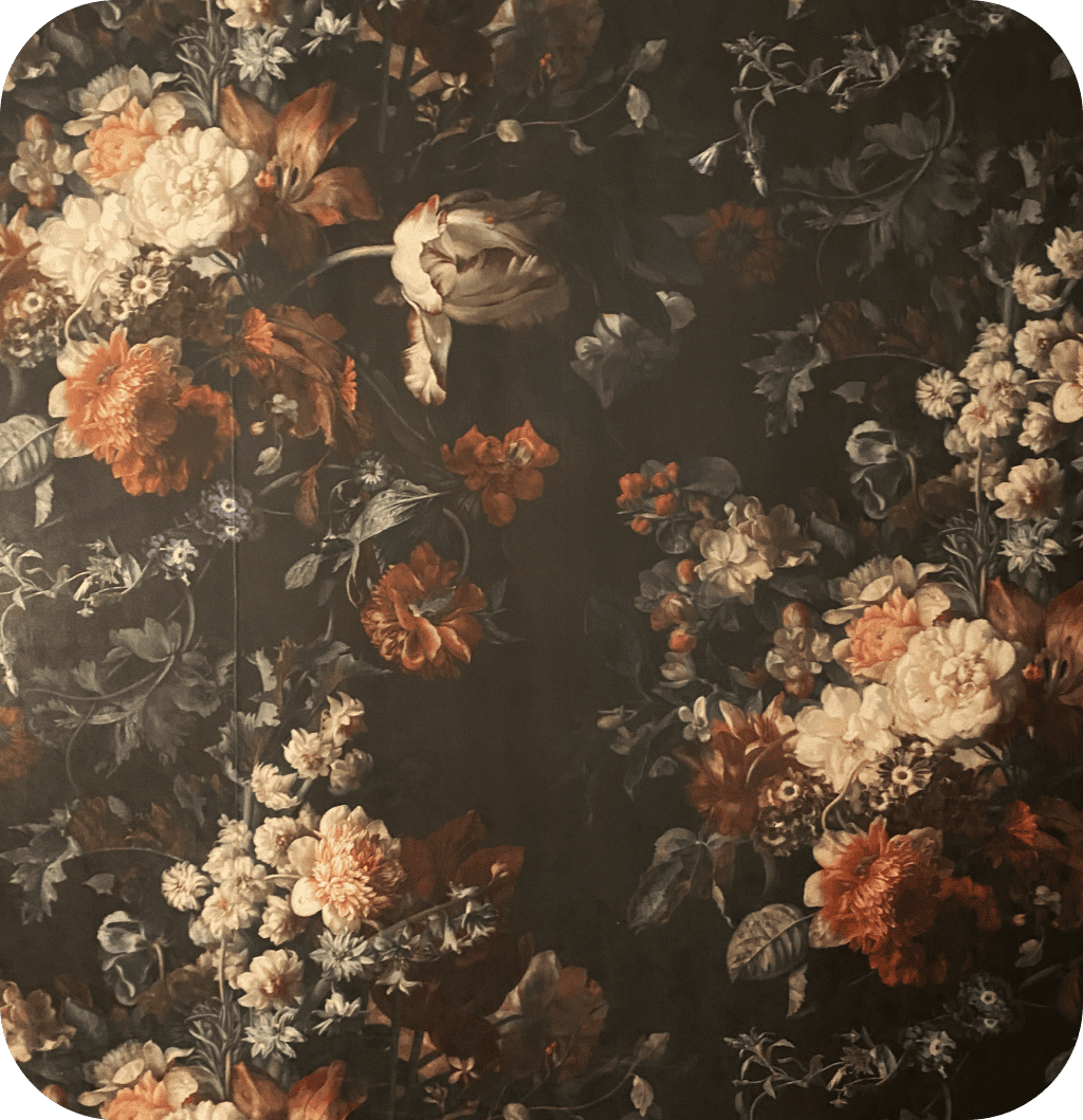 A floral vintage wallpaper with big colorful flowers and a black background.