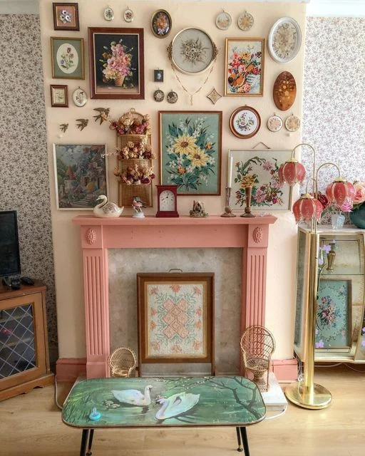 A whimsical gallery wall made of antique pictures and pastel colors with a hint of cottage core.