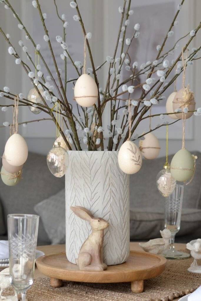 Easter eggs hanging from branches.