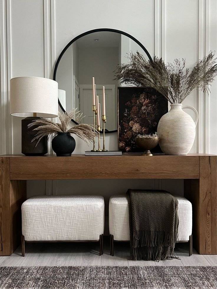 Two cotton cushions benches under wooden console table.