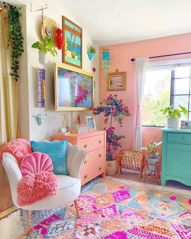 A colorful living room with bring pink and blue.