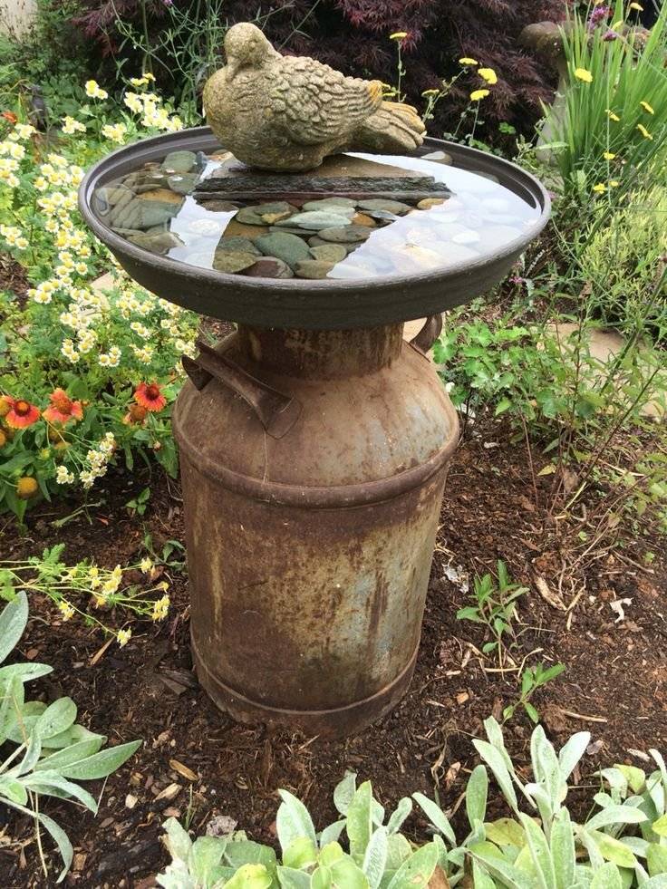 A bird bath in a garden.