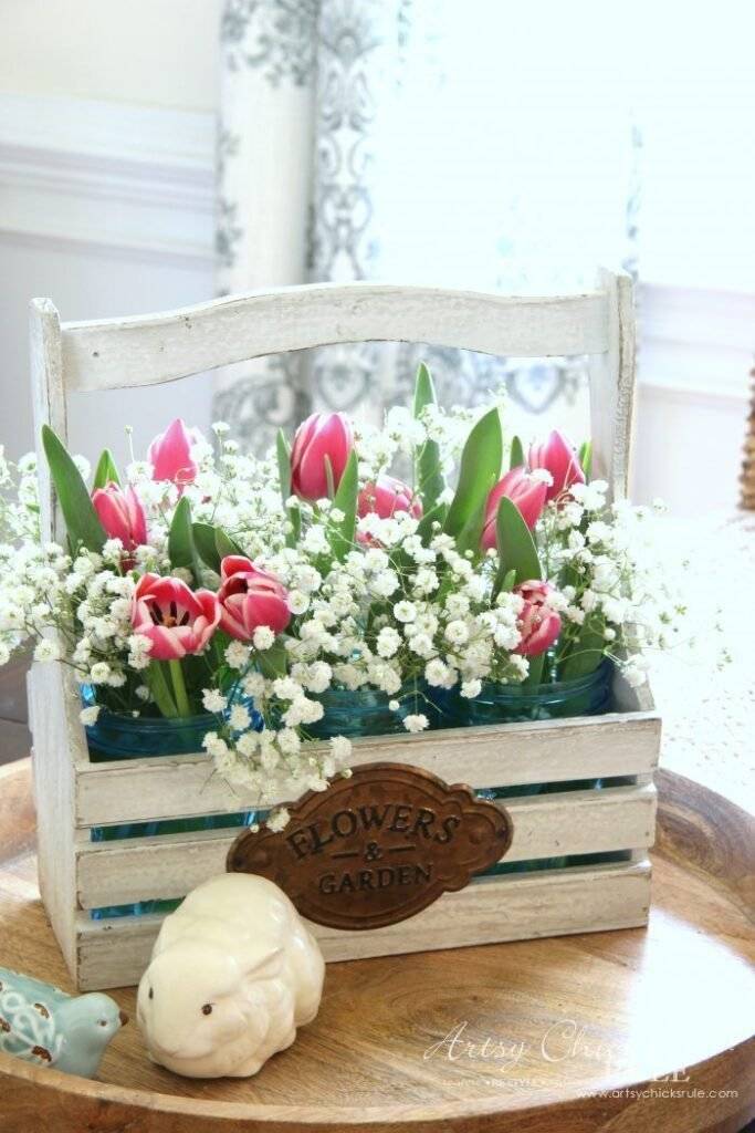 A wooden box filled with flowers.