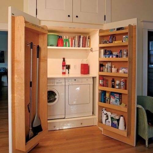 Wooden shelves on laundry closet double doors.