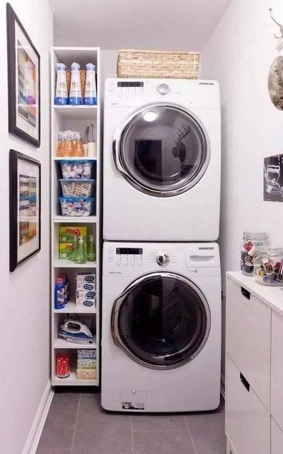 A vertical column shelf next to washing machines.