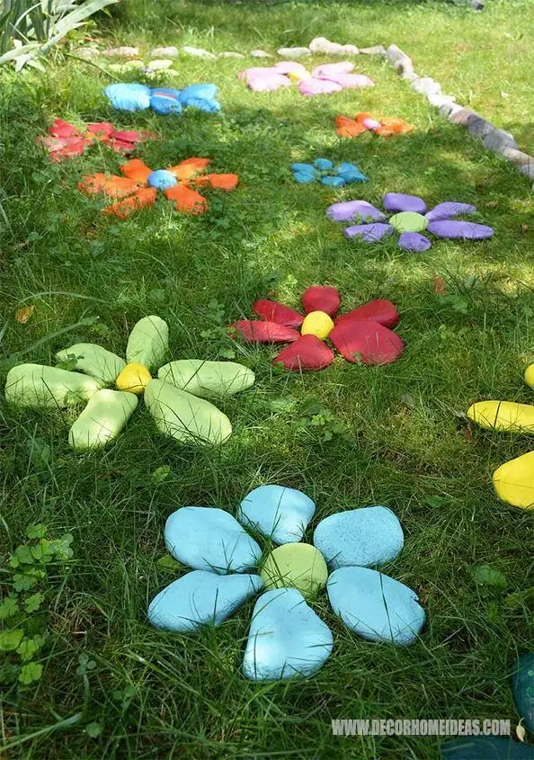 Rocks painted and placed as flowers.
