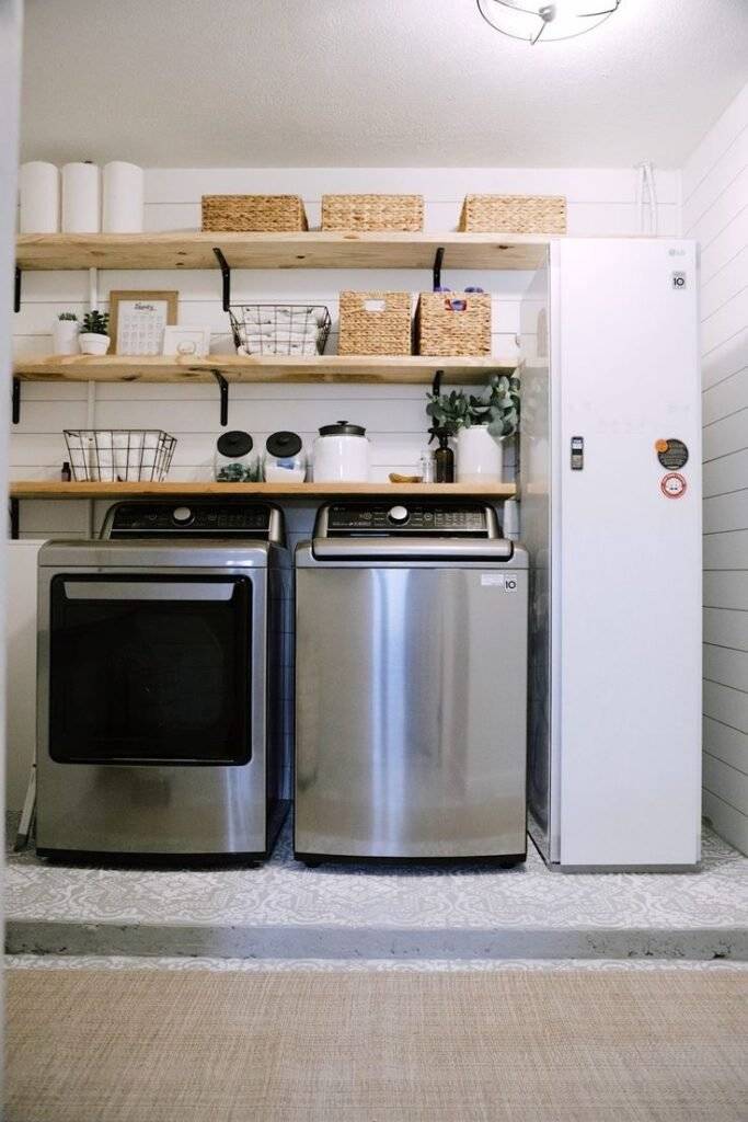 A laundry closet with woven and wire baskets.