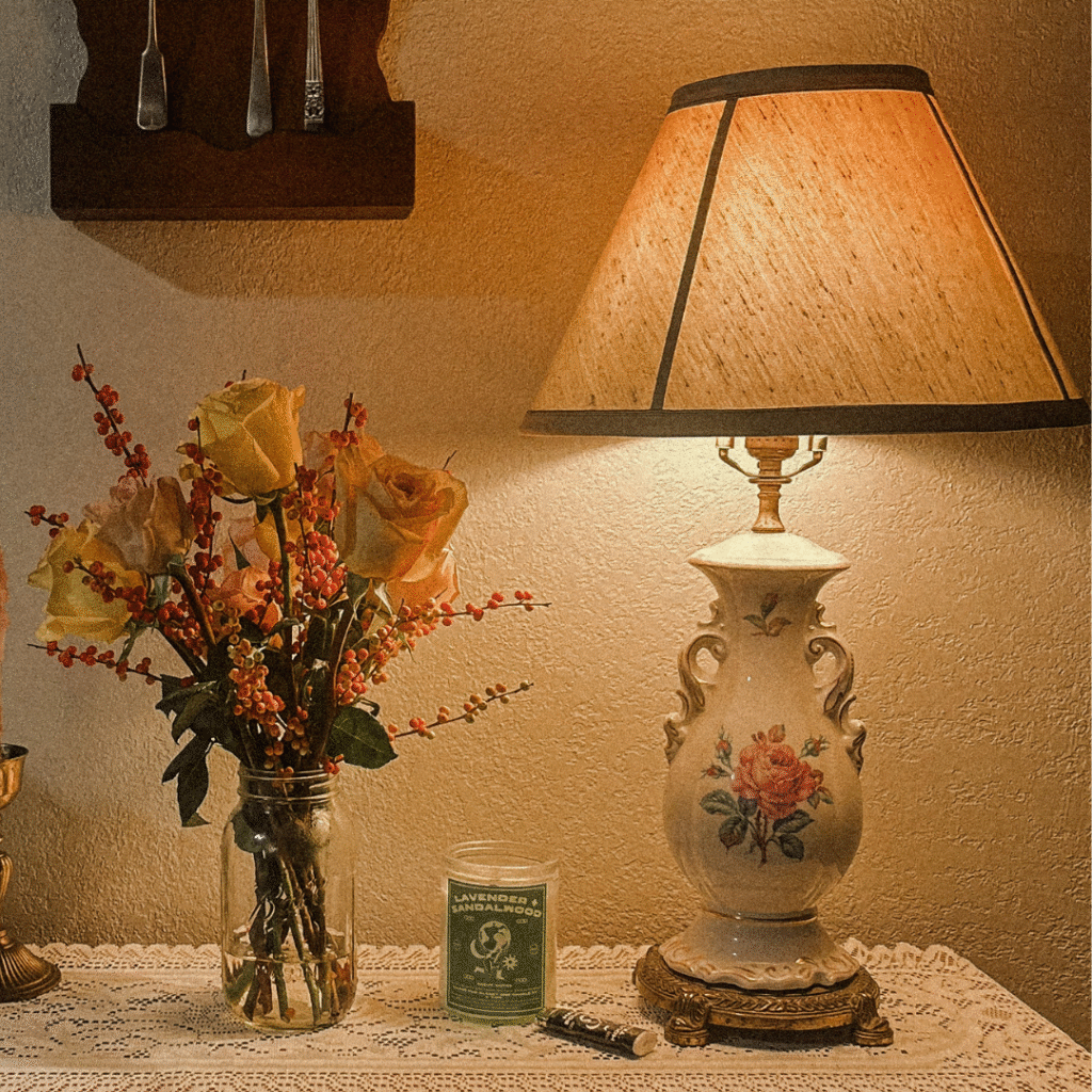 An antique white lamp with a floral pattern.