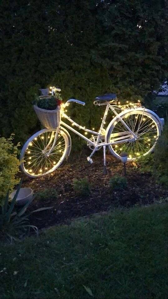 A bicycle with string lights.