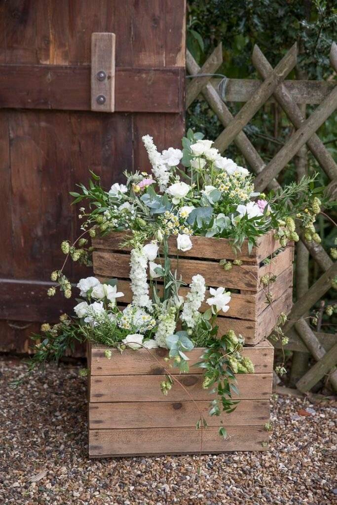 Wooden crates used as flower planters.