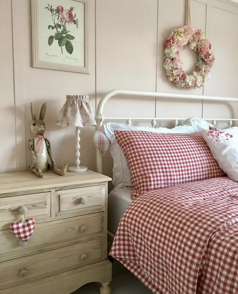 A red gingham bedding set for a feminine cottage core bedroom.