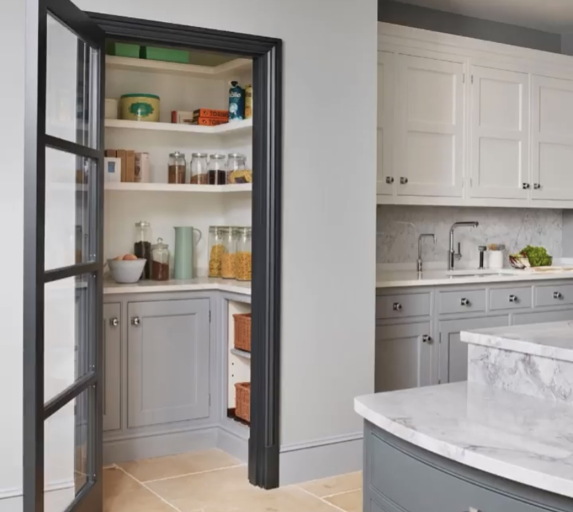 A gray and white walk in pantry.