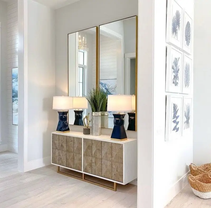 Two rectangular mirrors in a modern entryway.