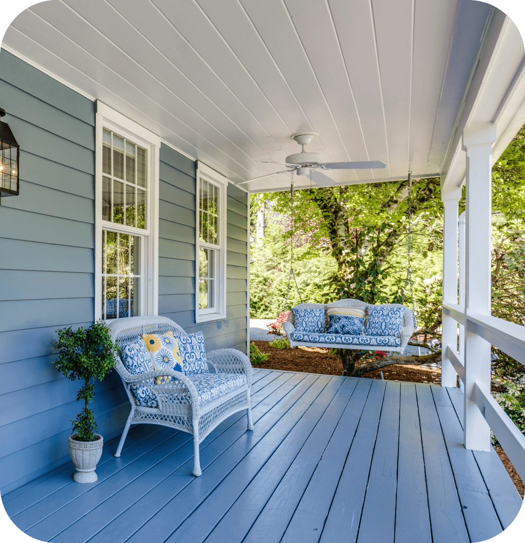 Blue summer porch with swing bench.
