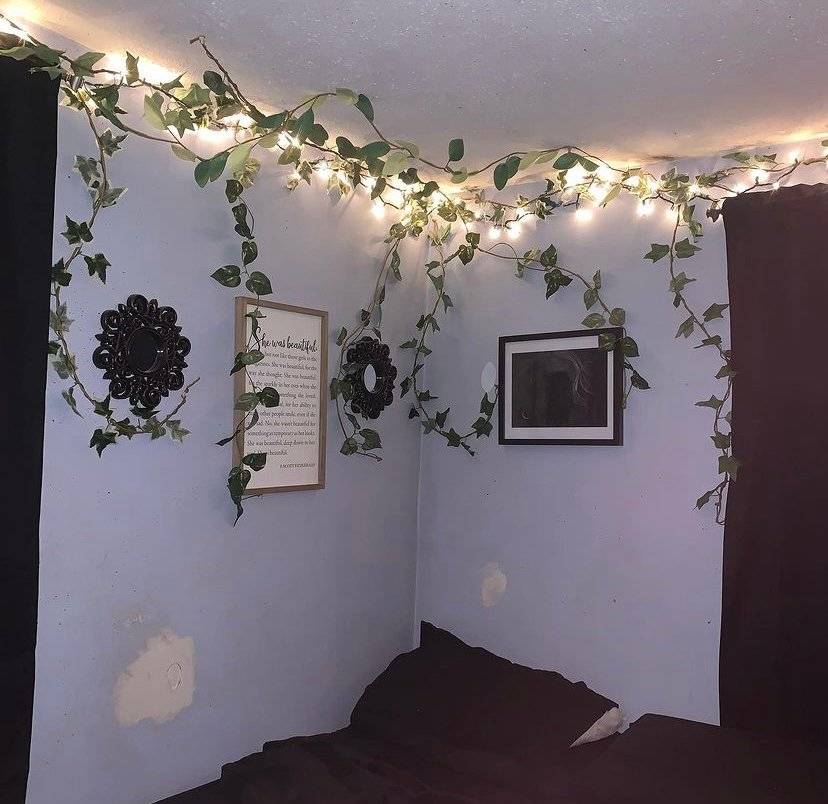 Fake trailing plants with LEDs in the corner of a bedroom.