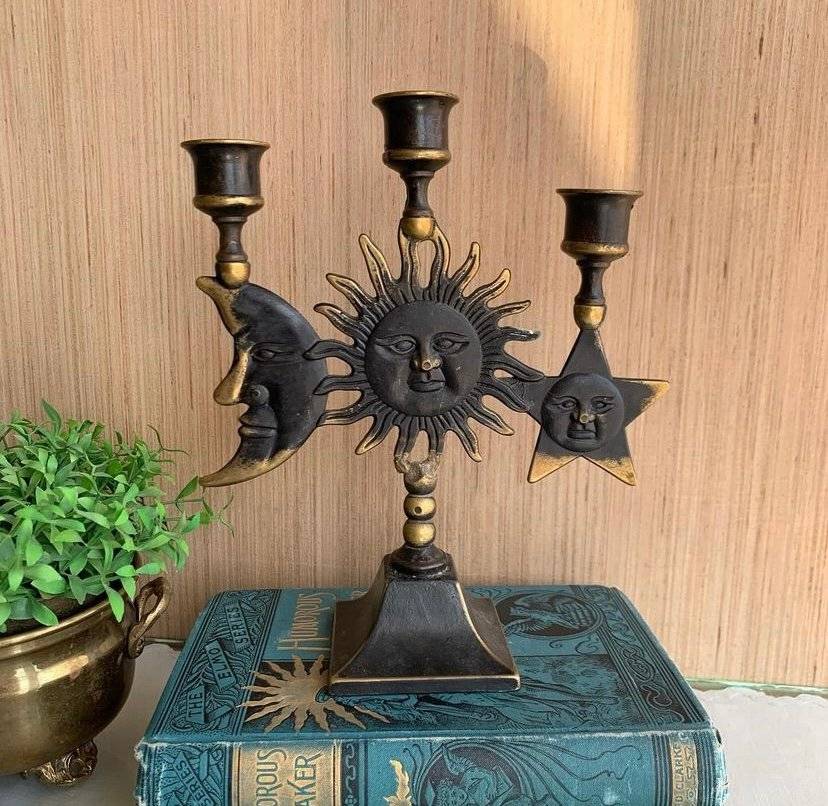 An antique sun and moon candle holders.