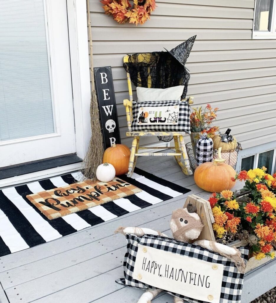 A buffalo plaid themed porch for Halloween.