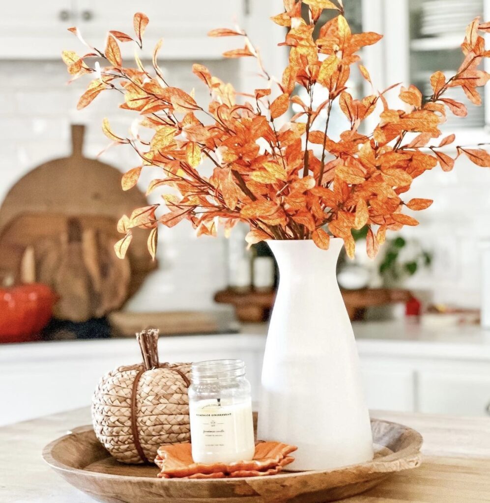 Fall stems with a woven pumpkin.