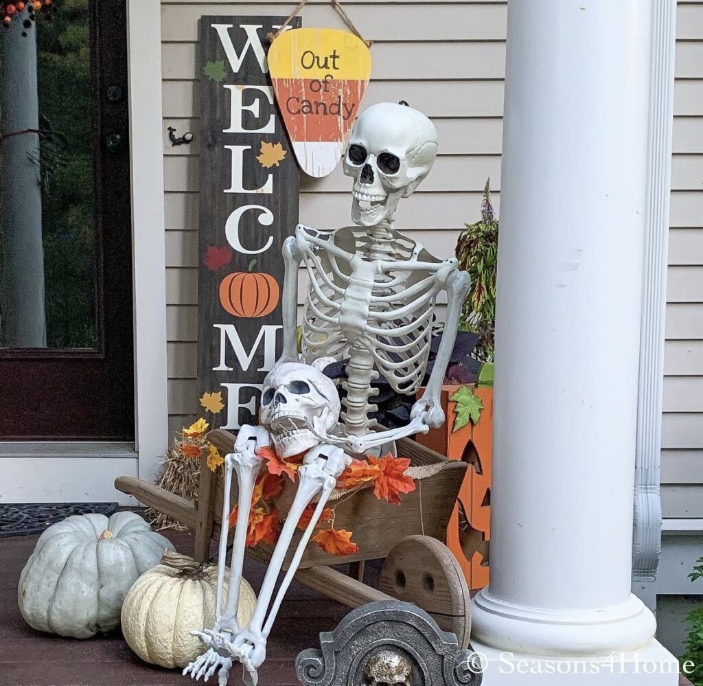 A skeleton with a welcome sign.