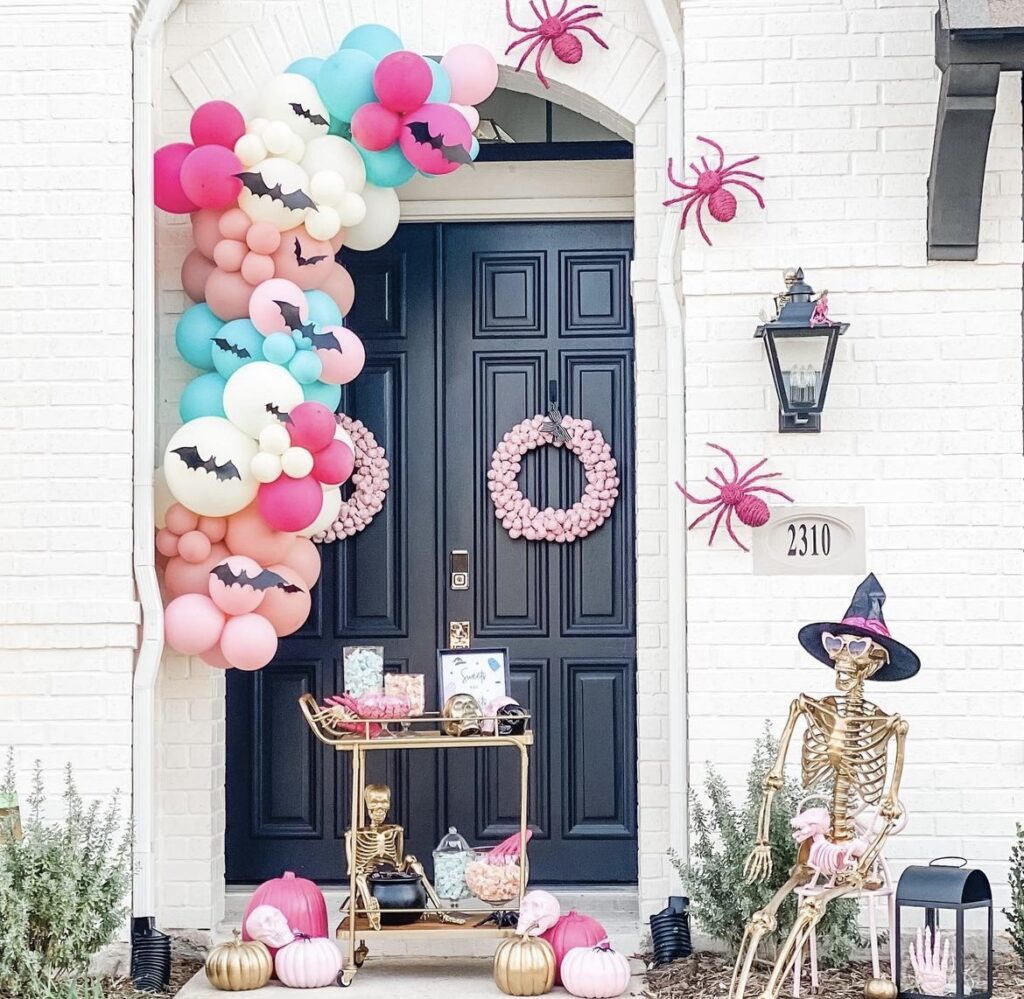 A pink and gold Halloween porch.