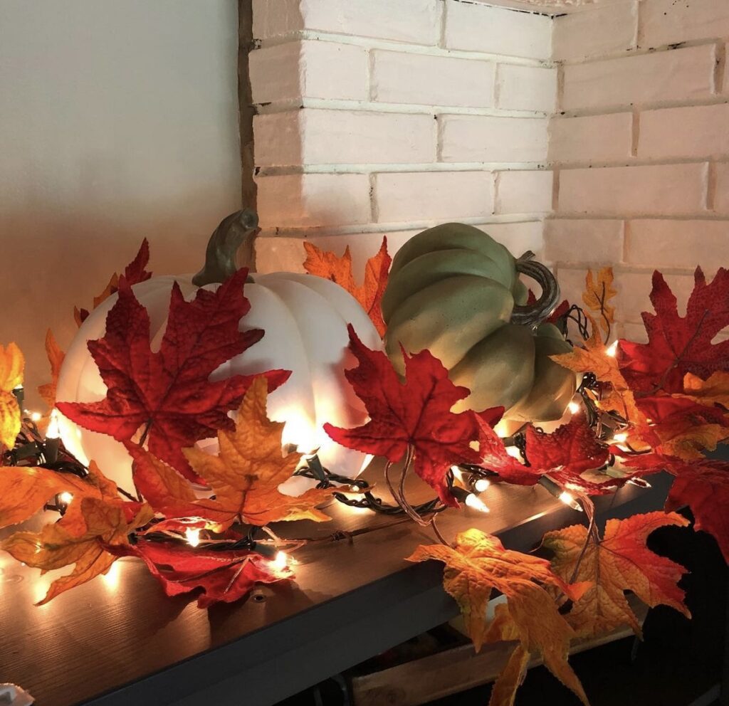 A fall garland string lights with pumpkins.