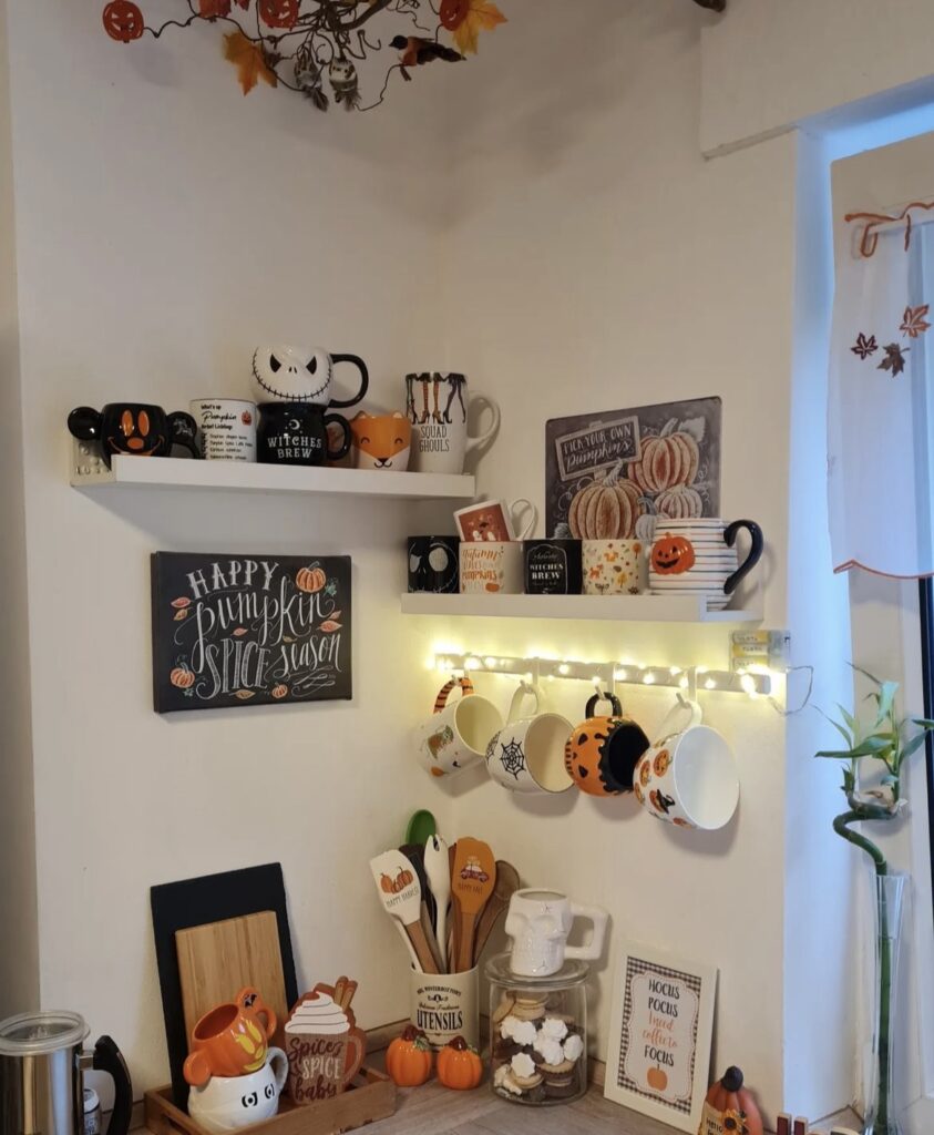 Fall mugs on shelves with fall signs.