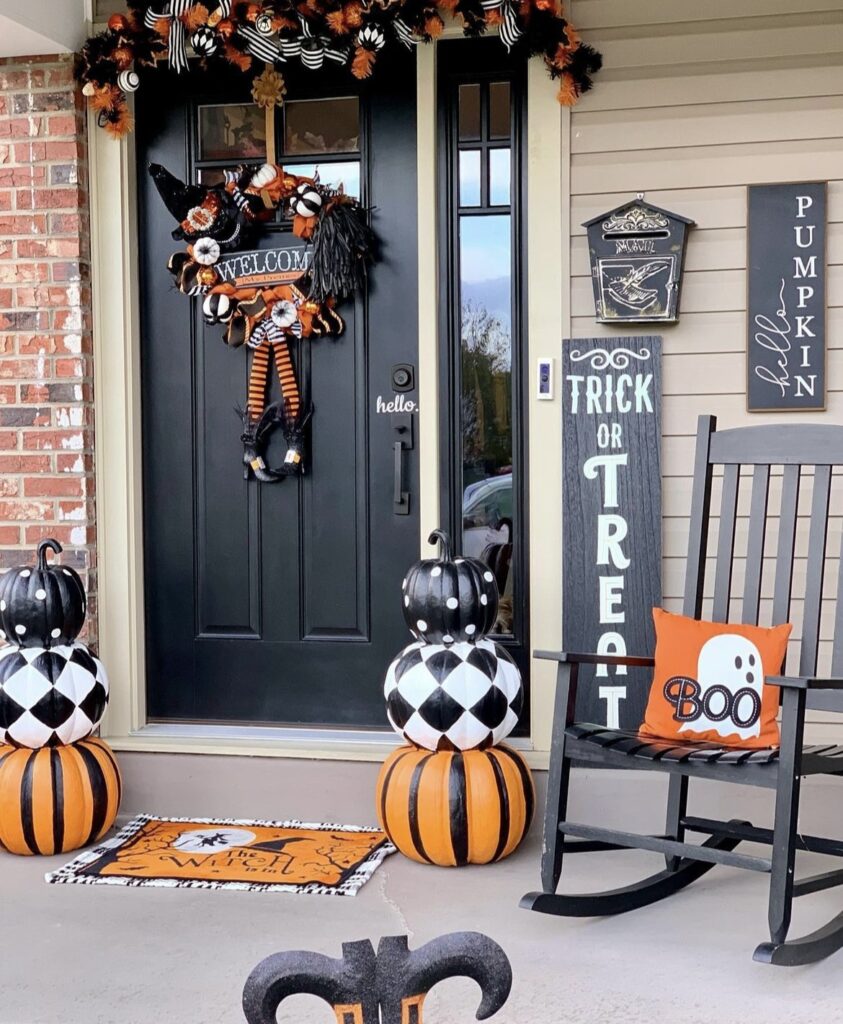 An orange and black Halloween porch.