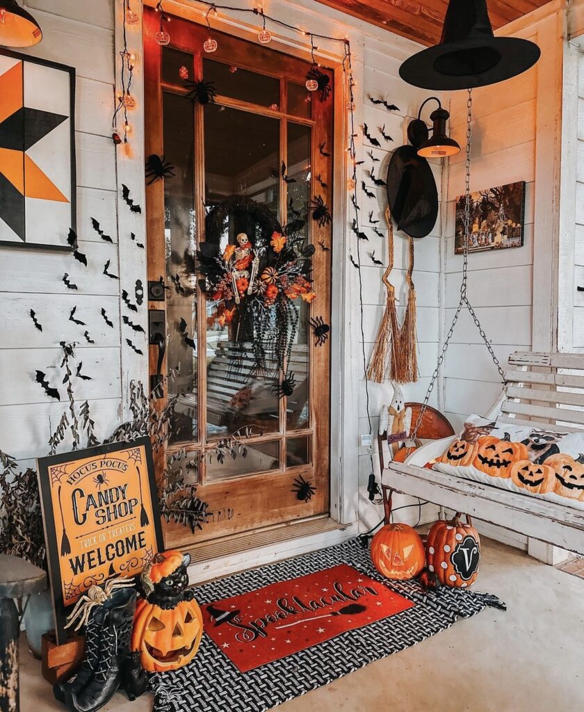 Flying bats and pumpkins on a porch.