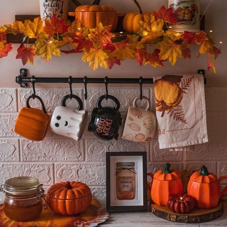 A maple leaf garland on a wooden shelf.