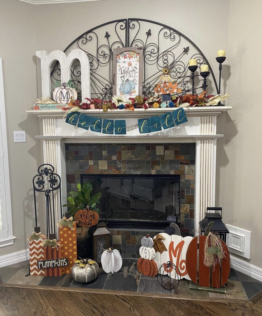 Fall cutouts and leaves on a mantel.