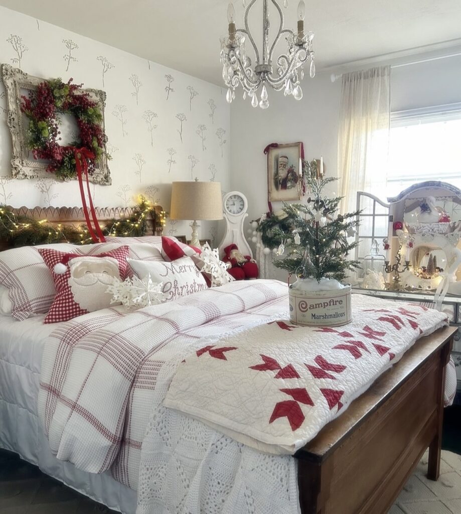 A bed with a Christmas wreath above it.