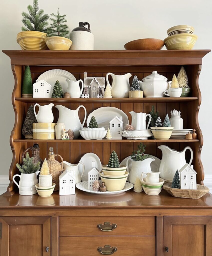 A cabinet filled with mini pine trees and pine cones.