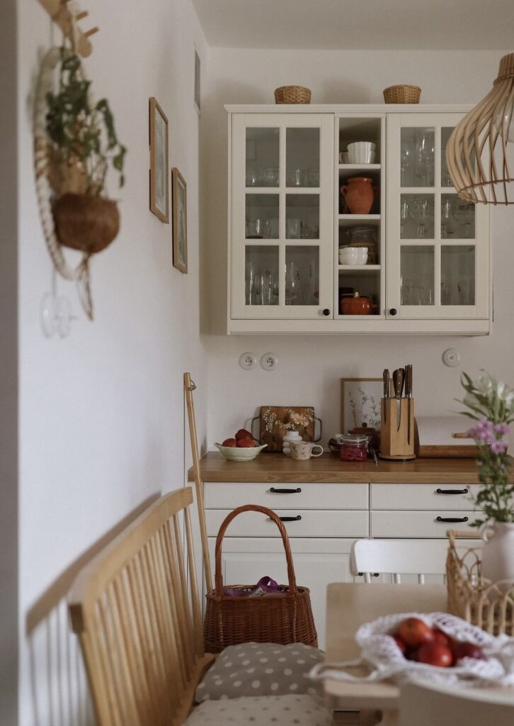 A vintage kitchen with wooden furniture.