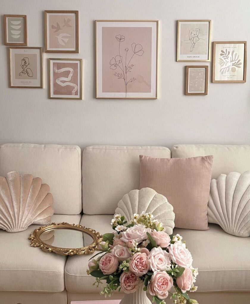 Pink minimalist prints above the sofa.