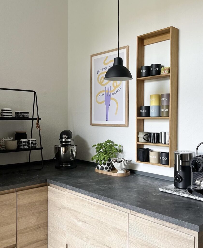 A modern kitchen with a black and brown color palette.