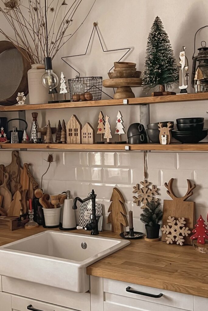 Christmas wooden cutouts on a kitchen shelf.