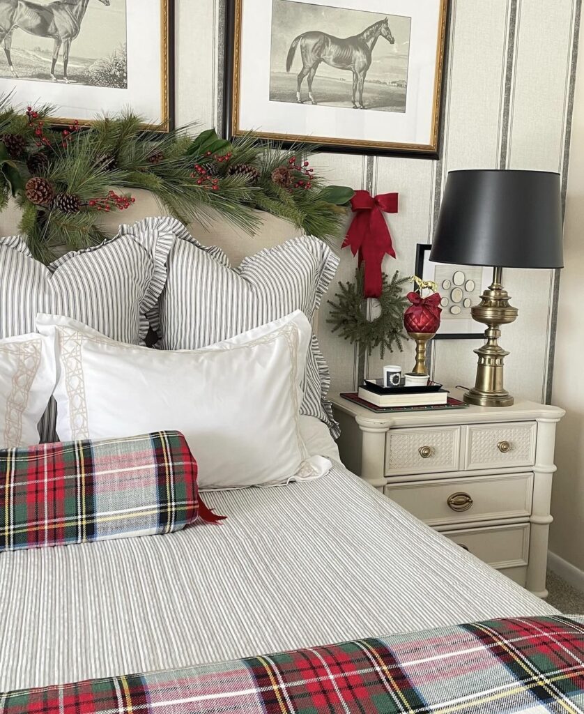 A bed with a green and red plaid bedding.