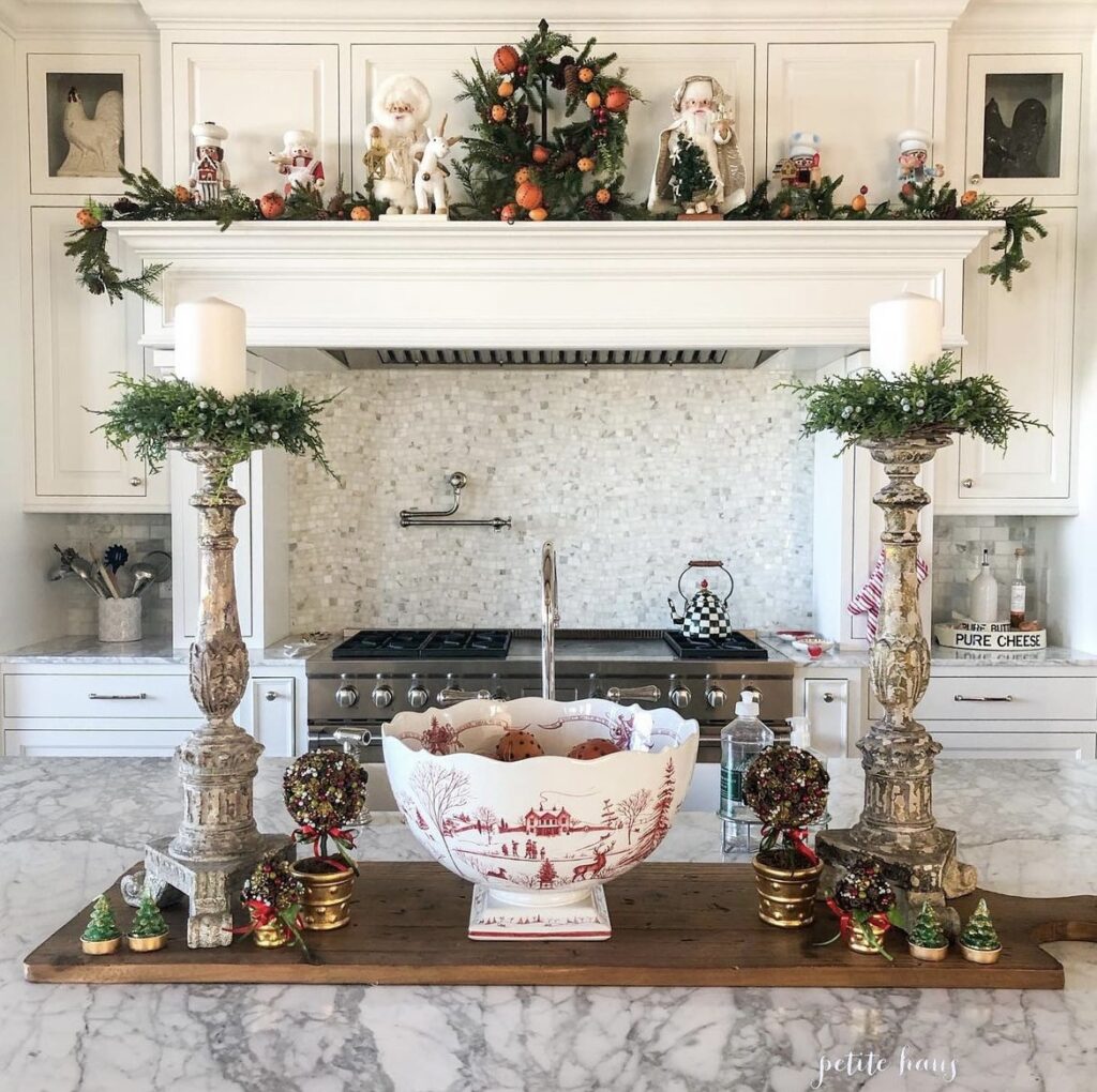 A pine wreath and Santa Claus on a kitchen hood.