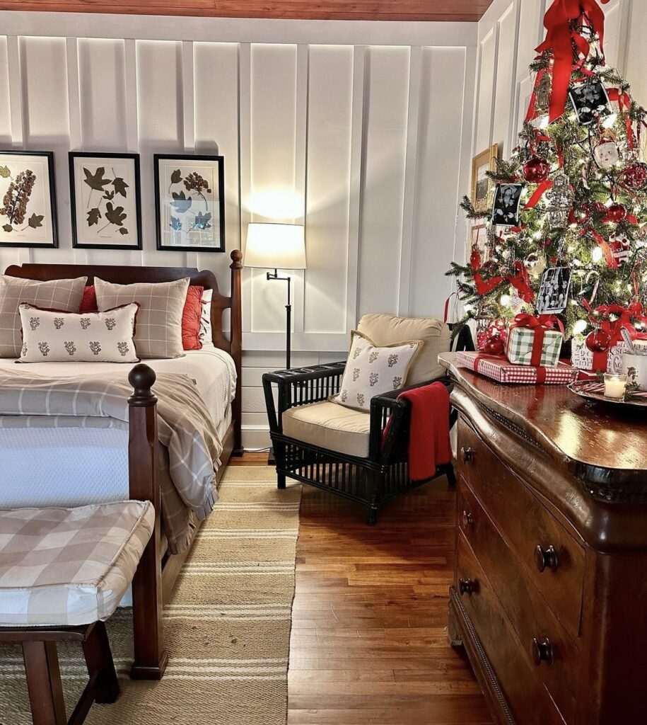 A Christmas tree on a chest of drawers.