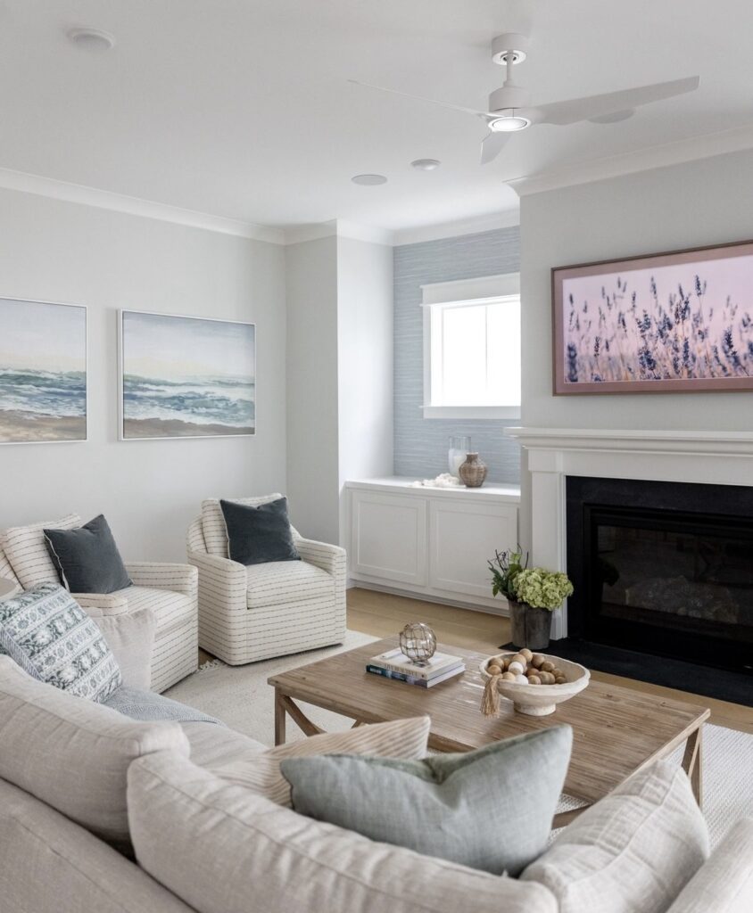 Seascape paintings above the sofa.