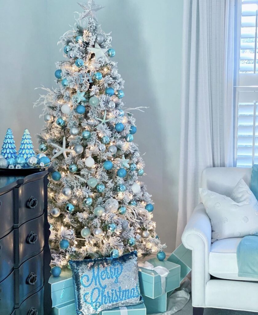 A coastal Christmas tree with blue starfishes and white branches.