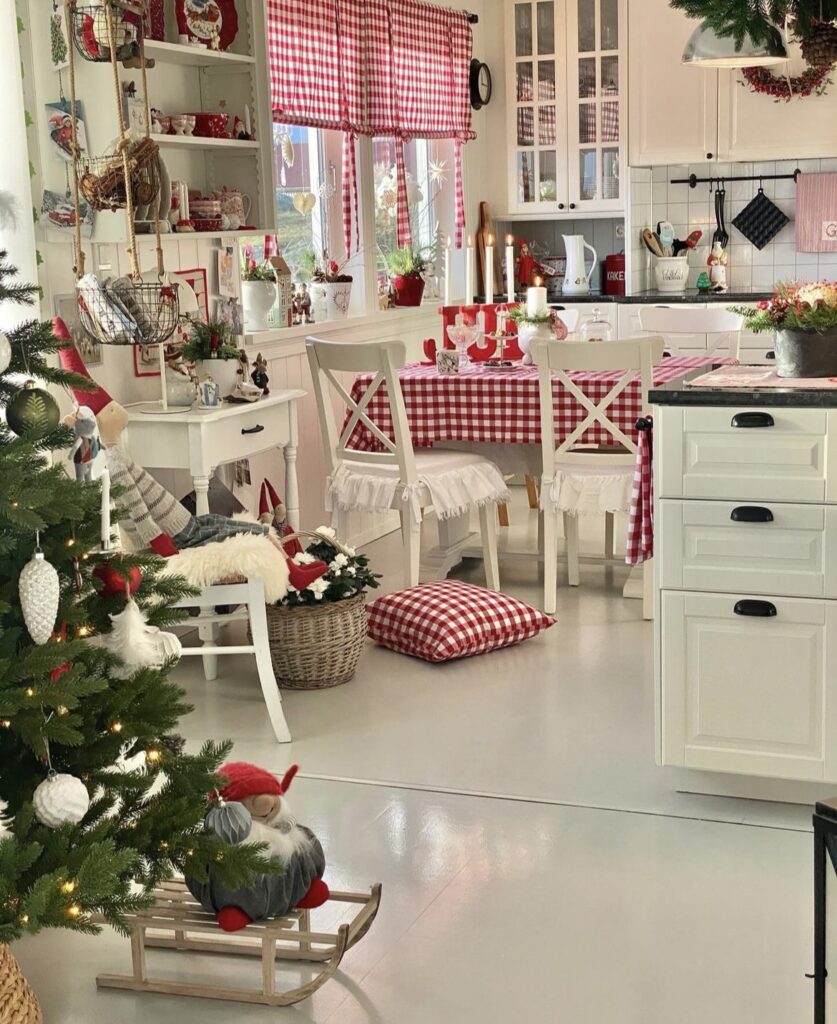 A small Christmas tree in a kitchen.