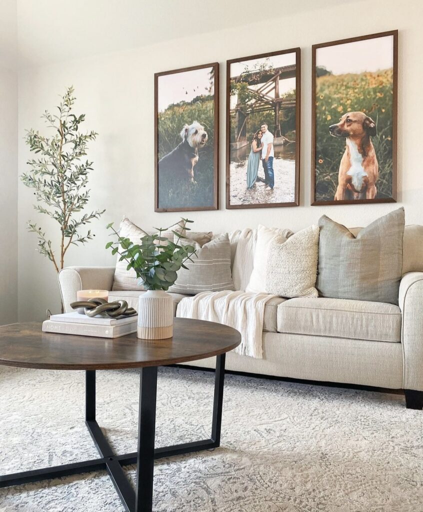 Personal photographs above the sofa.