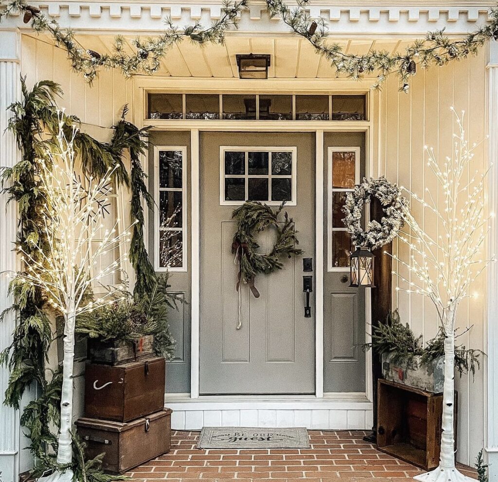 A Christmas porch with pine branches.