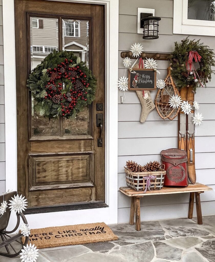 A Christmas porch with a snowflake garland.