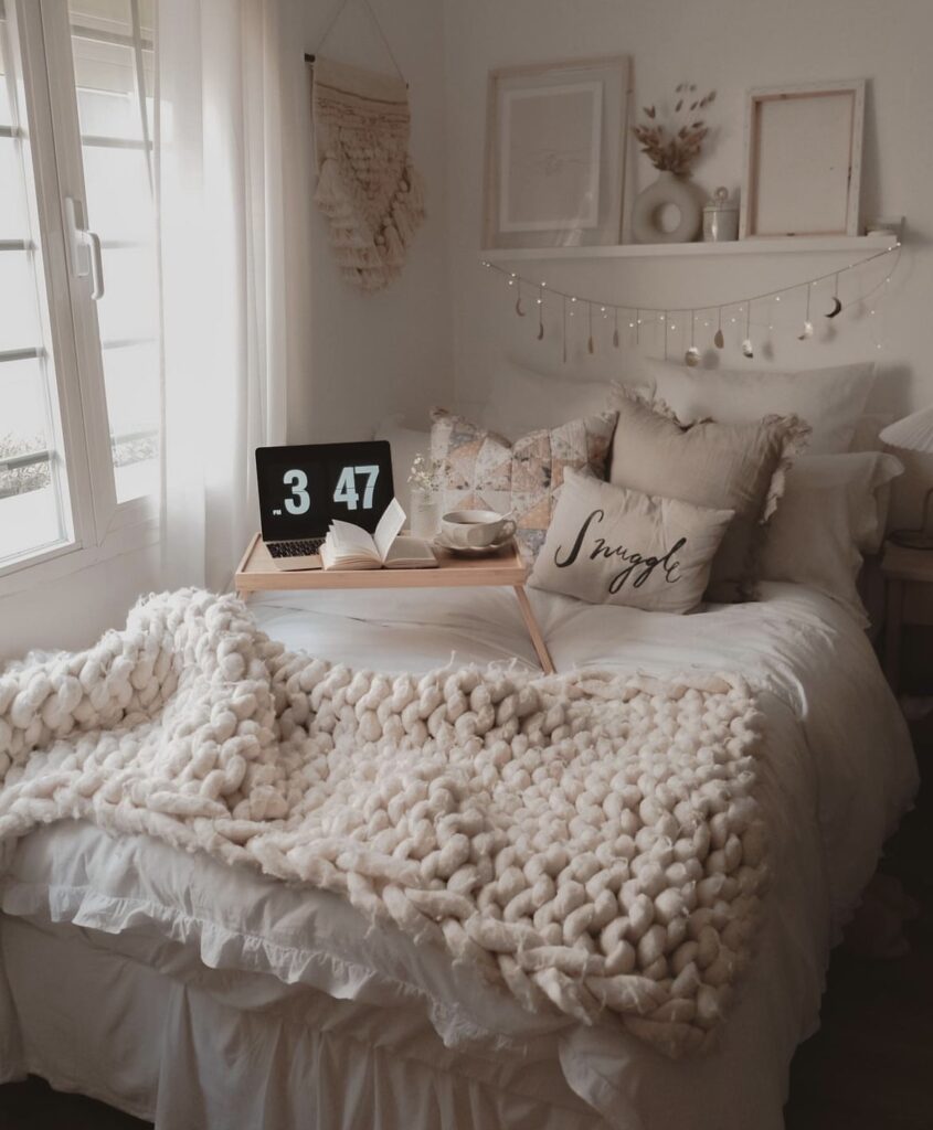 A cozy bedroom with a ruffled bedding.