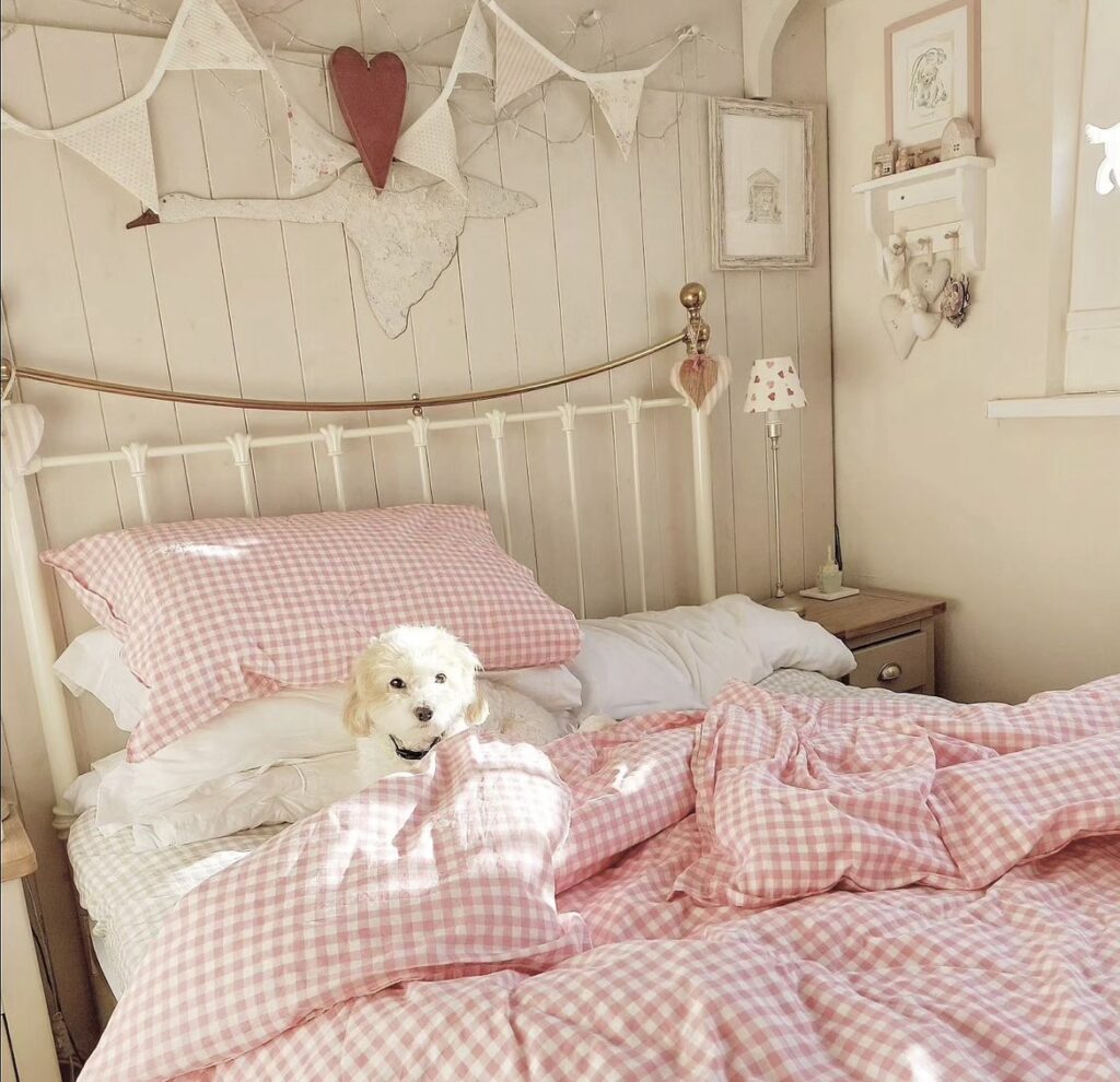 A vintage bedroom with a pink gingham bedding.