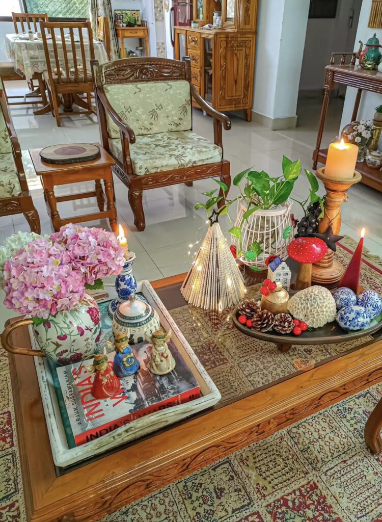 Angels, pine cones, red berries and vintage floral candle holders.