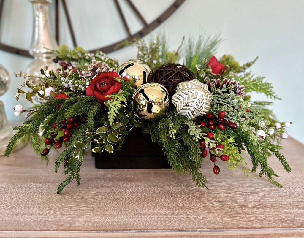 A Christmas floral arrangement with jingle bells.